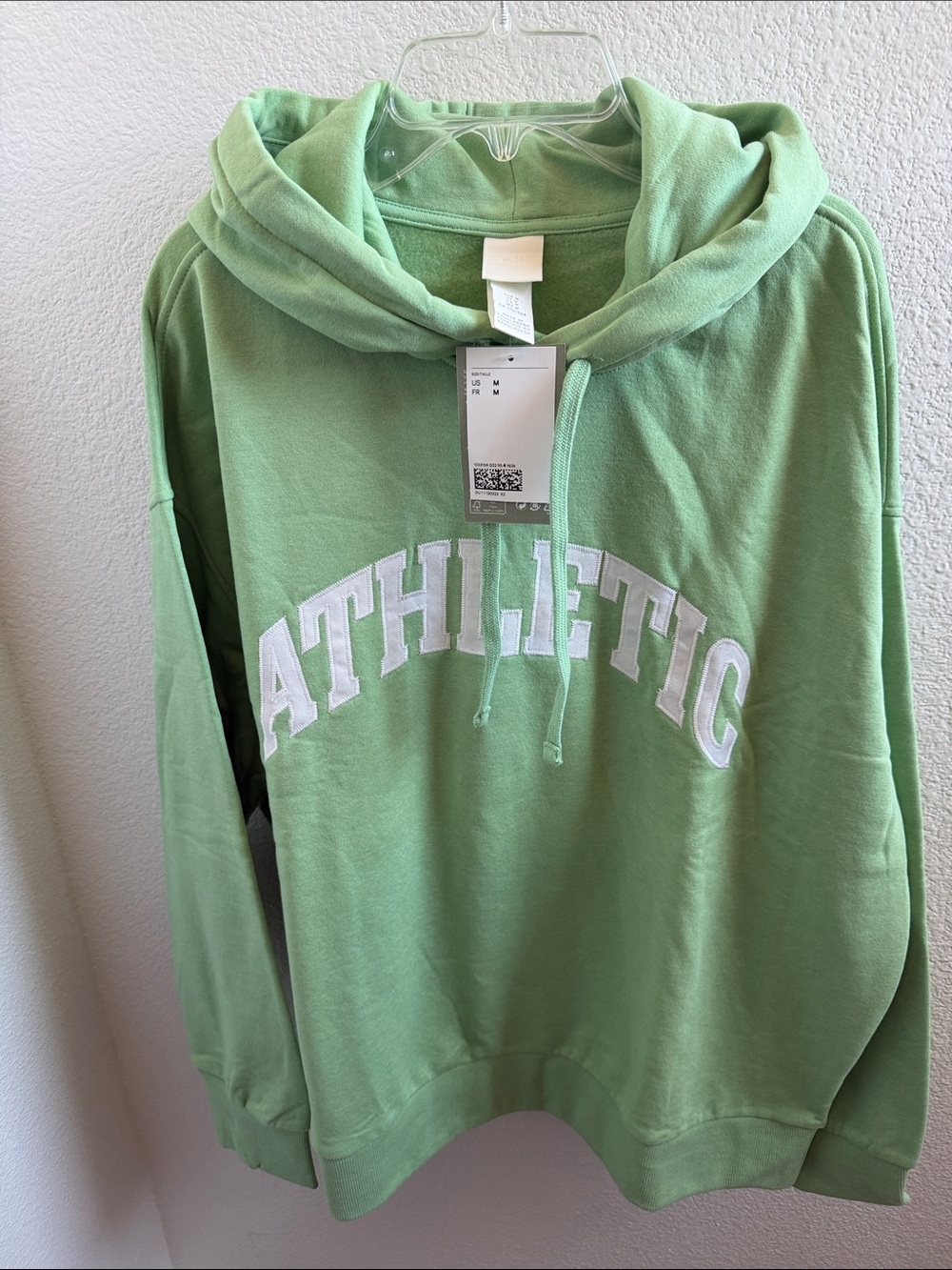 NWT OVERSIZED H&M Soft GreenHoodie with White Athletic Lettering.